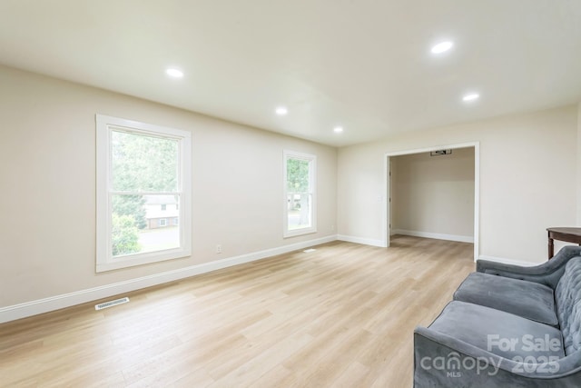 6641 Pawnee Dr, Charlotte, NC 28214 - unfurnished living room with light wood finished floors, baseboards, and recessed lighting