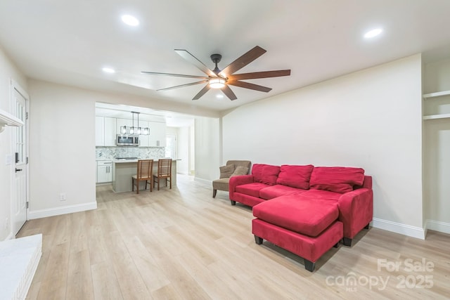 6641 Pawnee Dr, Charlotte, NC 28214 - living area with a ceiling fan, light wood finished floors, recessed lighting, and baseboards