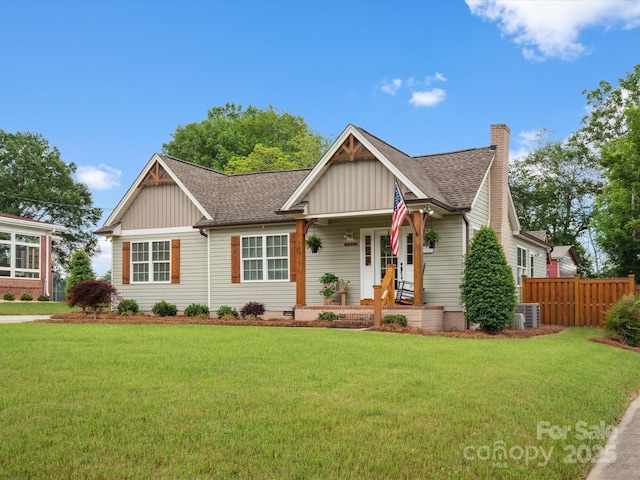 107 Pressley St, Clover, SC 29710 - view of front of property featuring board and batten siding, a shingled roof, a chimney, and cooling unit