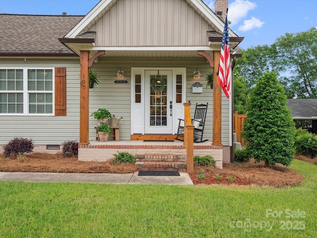 107 Pressley St, Clover, SC 29710 - bungalow-style house with crawl space, a porch, board and batten siding, a front lawn, and a shingled roof