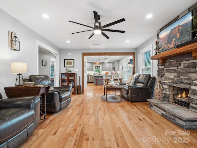 107 Pressley St, Clover, SC 29710 - living area featuring ceiling fan, light wood-style flooring, a stone fireplace, and recessed lighting
