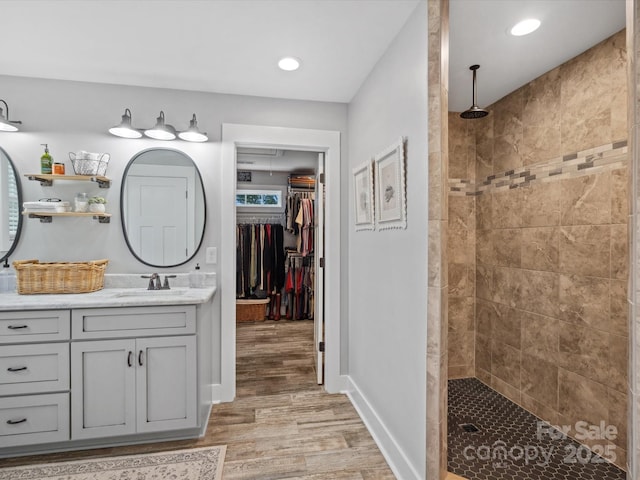 107 Pressley St, Clover, SC 29710 - bathroom with wood finished floors, vanity, a walk in shower, baseboards, and recessed lighting