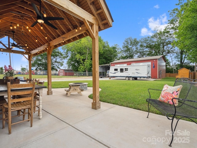 107 Pressley St, Clover, SC 29710 - view of patio featuring an outdoor fire pit, an outbuilding, a storage shed, ceiling fan, and a gazebo