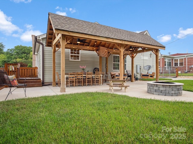 107 Pressley St, Clover, SC 29710 - back of property with a gazebo, a fire pit, a shingled roof, and a patio area