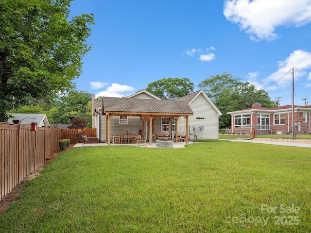 107 Pressley St, Clover, SC 29710 - rear view of house with a patio area, an outdoor fire pit, and roof with shingles