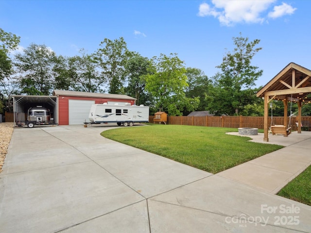 107 Pressley St, Clover, SC 29710 - view of yard featuring a fire pit, a garage, and driveway