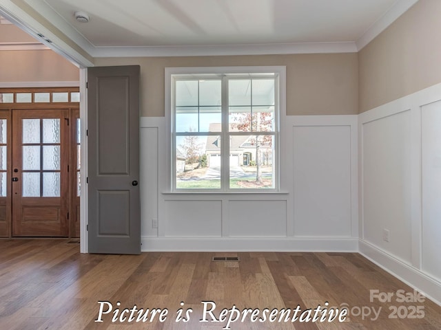 3439 Stags Leap Way, York, SC 29745 - foyer entrance with a decorative wall, wood finished floors, wainscoting, and ornamental molding