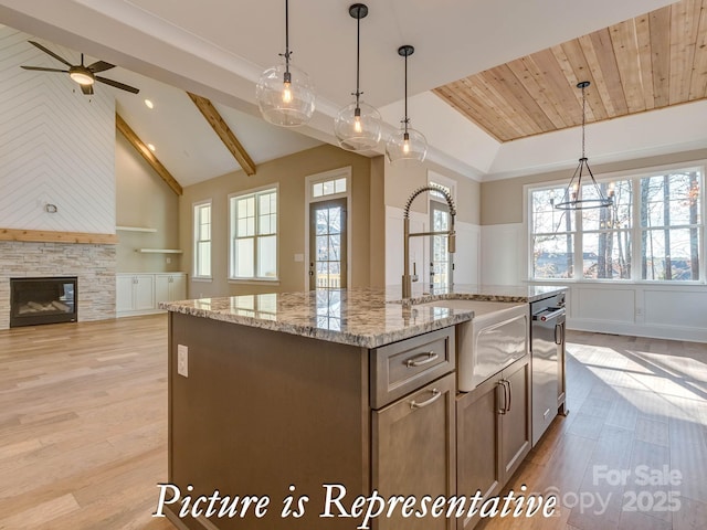 3439 Stags Leap Way, York, SC 29745 - kitchen featuring a sink, stainless steel dishwasher, open floor plan, a center island with sink, and light wood-type flooring