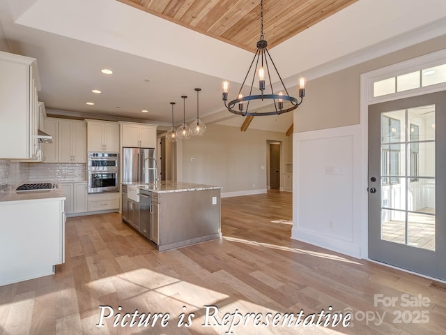 3439 Stags Leap Way, York, SC 29745 - kitchen featuring stainless steel appliances, a chandelier, backsplash, pendant lighting, and open floor plan