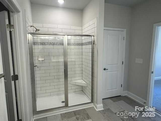 2924 Noritake Trl Unit 67, Albemarle, NC 28001 - bathroom featuring a stall shower, baseboards, and recessed lighting