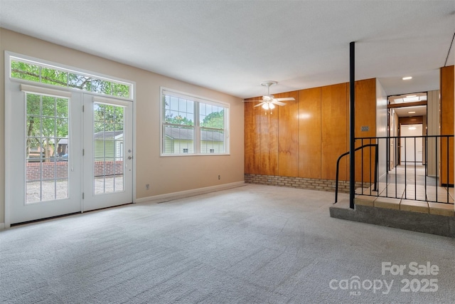 467 16th Ave NW, Hickory, NC 28601 - unfurnished living room featuring carpet, baseboards, and ceiling fan