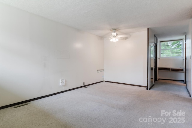 467 16th Ave NW, Hickory, NC 28601 - empty room with a ceiling fan, light carpet, and baseboards