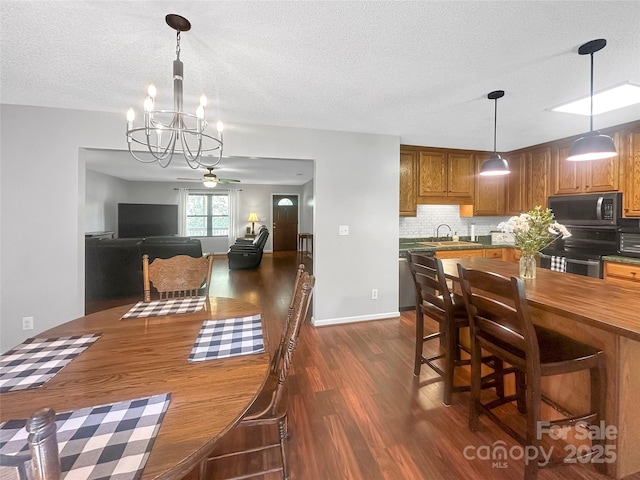 118 Harvey Vale Cir, Blacksburg, SC 29702 - dining room featuring dark wood finished floors, a chandelier, a textured ceiling, and ceiling fan