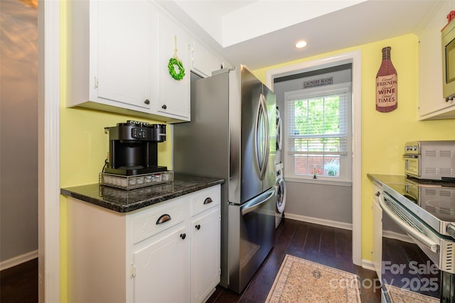9239 N Vicksburg Park Ct, Charlotte, NC 28210 - kitchen with baseboards, white cabinets, stacked washer / drying machine, dark wood-type flooring, and recessed lighting