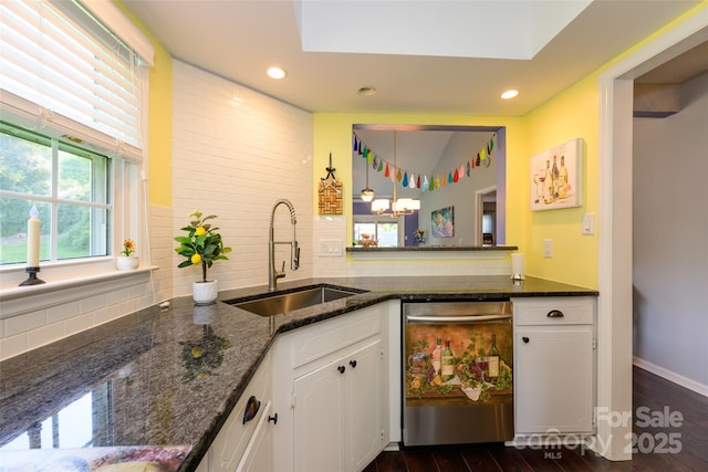 9239 N Vicksburg Park Ct, Charlotte, NC 28210 - kitchen featuring stainless steel dishwasher, a sink, white cabinetry, backsplash, and dark wood-type flooring