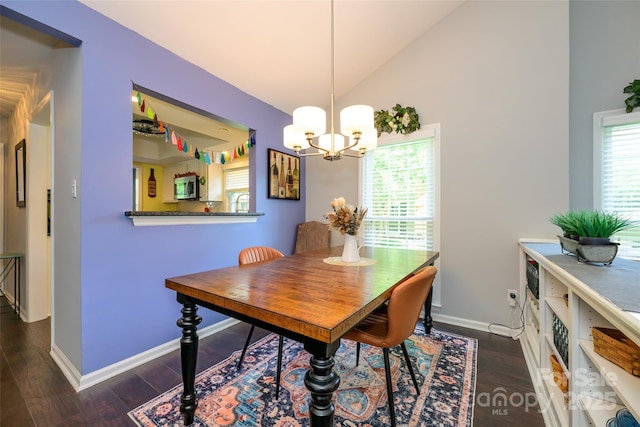 9239 N Vicksburg Park Ct, Charlotte, NC 28210 - dining room featuring plenty of natural light, a chandelier, dark wood-style floors, baseboards, and lofted ceiling