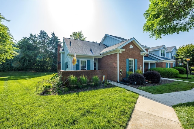 9239 N Vicksburg Park Ct, Charlotte, NC 28210 - view of front of property featuring brick siding, a front yard, and a chimney