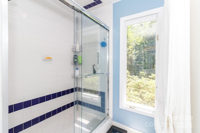 6119 Bittersweet Ln, Charlotte, NC 28270 - bathroom featuring a stall shower, plenty of natural light, and baseboards