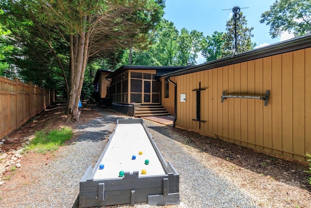 6119 Bittersweet Ln, Charlotte, NC 28270 - view of yard featuring a sunroom, fence, and a game area
