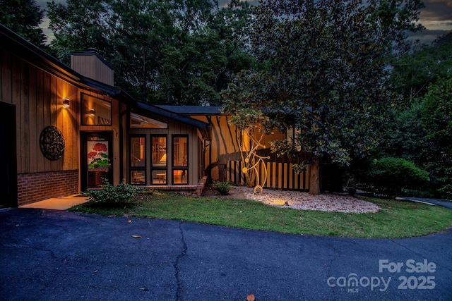 6119 Bittersweet Ln, Charlotte, NC 28270 - entrance to property with a chimney