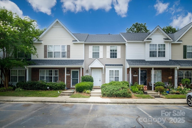 15042 Deshler Ct, Charlotte, NC 28273 - townhome / multi-family property with brick siding, uncovered parking, and roof with shingles
