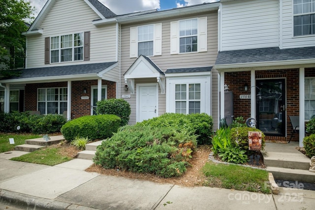 15042 Deshler Ct, Charlotte, NC 28273 - multi unit property featuring brick siding, a shingled roof, and a porch