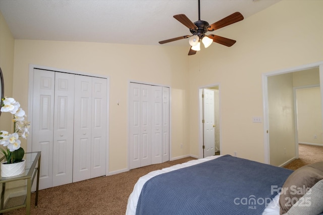 15042 Deshler Ct, Charlotte, NC 28273 - bedroom featuring multiple closets, carpet, high vaulted ceiling, baseboards, and a ceiling fan