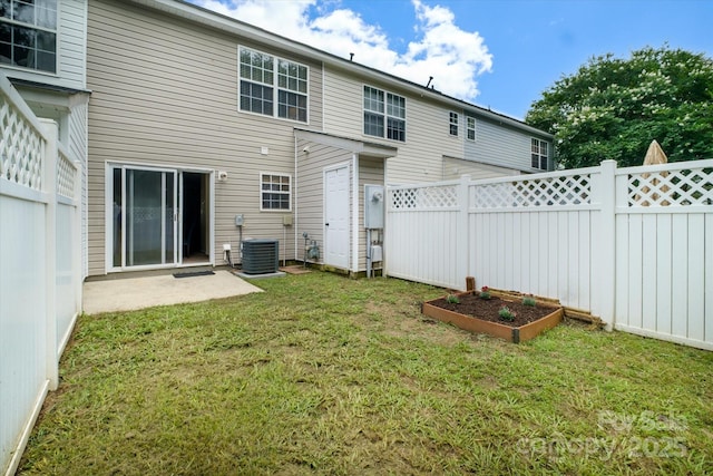 15042 Deshler Ct, Charlotte, NC 28273 - back of property featuring a vegetable garden and central AC unit