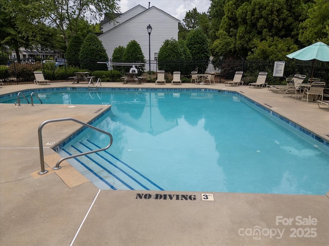 15042 Deshler Ct, Charlotte, NC 28273 - community pool featuring a patio area