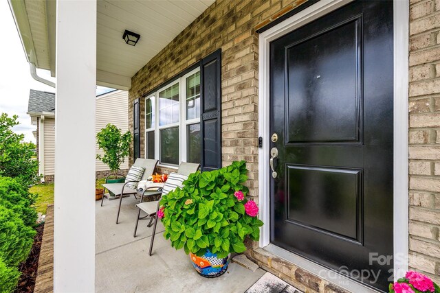 922 Bunker Trce, Rock Hill, SC 29730 - doorway to property featuring a porch and brick siding