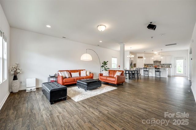922 Bunker Trce, Rock Hill, SC 29730 - living area featuring dark wood-style flooring, baseboards, recessed lighting, a chandelier, and ornate columns