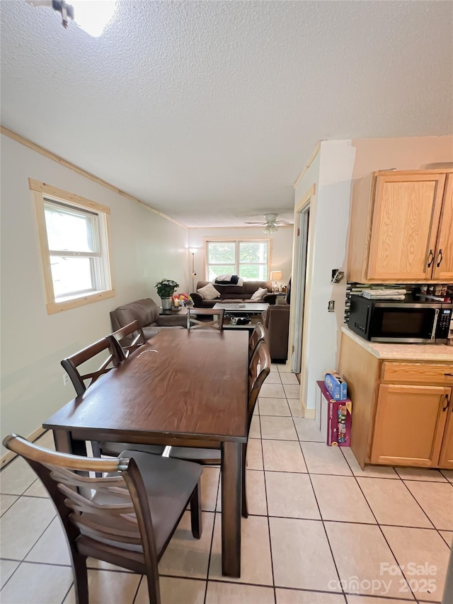 99 Boone St, Spruce Pine, NC 28777 - dining space with light tile patterned floors and a textured ceiling