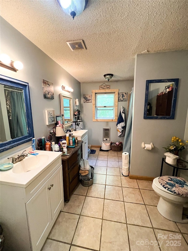 99 Boone St, Spruce Pine, NC 28777 - bathroom with vanity, tile patterned floors, and a textured ceiling