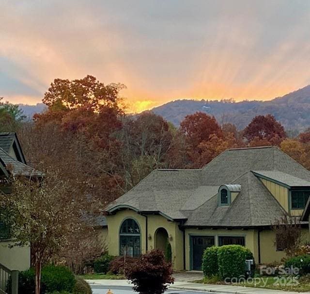 63 Chantilly Dr, Asheville, NC 28804 - view of front of property with stucco siding and a mountain view