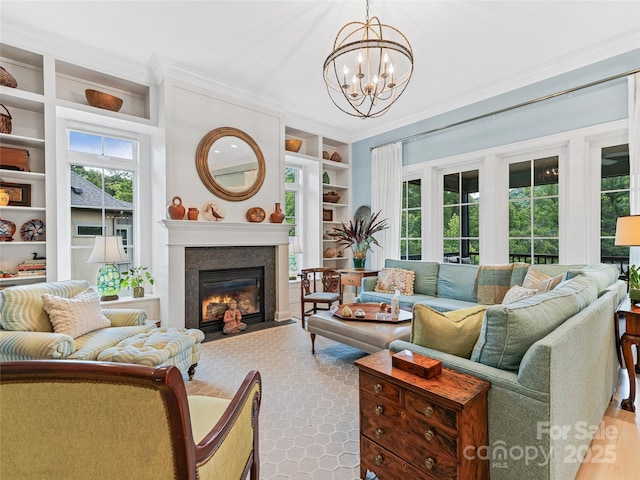 63 Chantilly Dr, Asheville, NC 28804 - living room featuring built in shelves, a chandelier, healthy amount of natural light, and ornamental molding