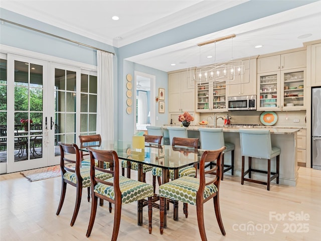 63 Chantilly Dr, Asheville, NC 28804 - dining room with crown molding, french doors, recessed lighting, and light wood-type flooring