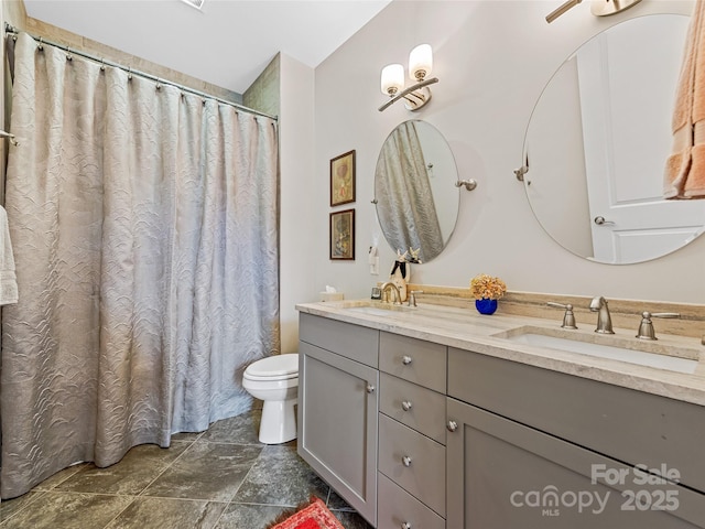 63 Chantilly Dr, Asheville, NC 28804 - full bathroom with double vanity, toilet, stone finish floors, and a shower with curtain
