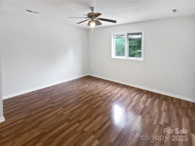 7308 Pleasant Hill Church Rd, Marshville, NC 28103 - empty room featuring dark wood finished floors, baseboards, and a ceiling fan