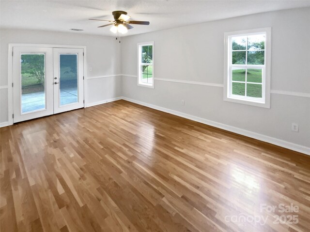 7308 Pleasant Hill Church Rd, Marshville, NC 28103 - empty room featuring french doors, wood finished floors, a ceiling fan, and baseboards