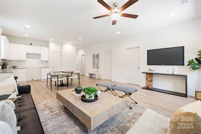 6 Bridge St, Lowell, NC 28098 - living area with a ceiling fan, light wood finished floors, recessed lighting, and baseboards