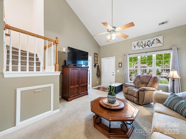 3446 Broadwick St, Charlotte, NC 28213 - living area with high vaulted ceiling, stairs, ceiling fan, light colored carpet, and baseboards