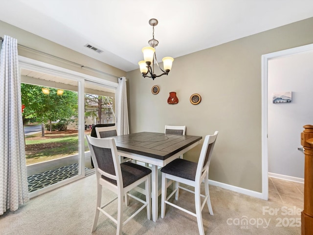 3446 Broadwick St, Charlotte, NC 28213 - dining space with a chandelier, light carpet, and baseboards