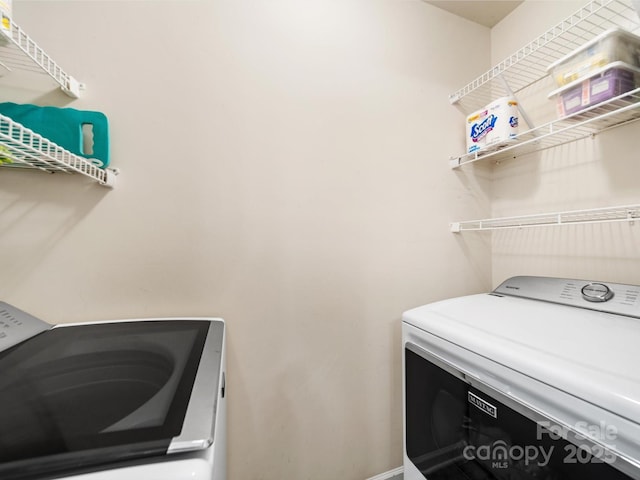 3446 Broadwick St, Charlotte, NC 28213 - washroom with washing machine and dryer and baseboards