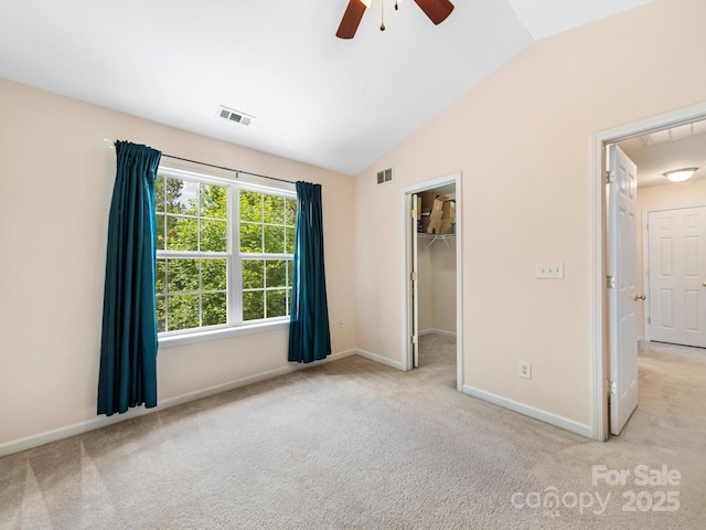 3446 Broadwick St, Charlotte, NC 28213 - unfurnished bedroom featuring lofted ceiling, carpet floors, baseboards, a walk in closet, and a ceiling fan