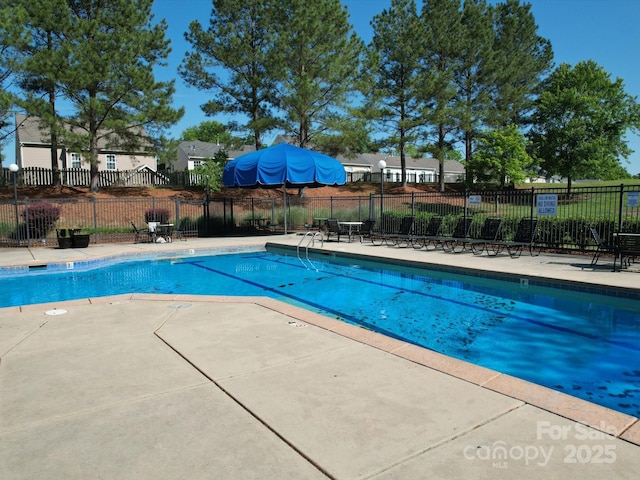 3446 Broadwick St, Charlotte, NC 28213 - view of swimming pool featuring fence and a patio