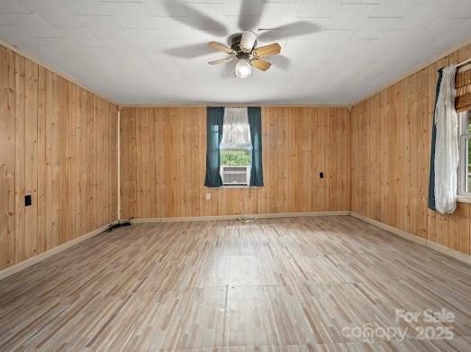 751 Ted Smith Rd, Rutherfordton, NC 28139 - unfurnished room with wood finished floors, ceiling fan, baseboards, and wooden walls