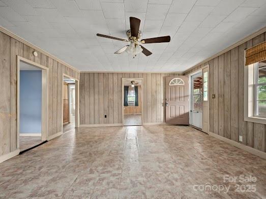 751 Ted Smith Rd, Rutherfordton, NC 28139 - unfurnished room with ceiling fan, wooden walls, and baseboards