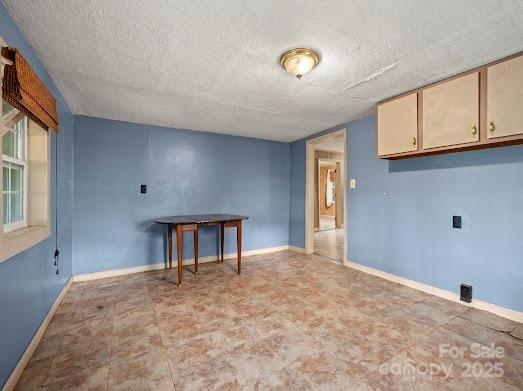 751 Ted Smith Rd, Rutherfordton, NC 28139 - empty room featuring a textured ceiling and baseboards