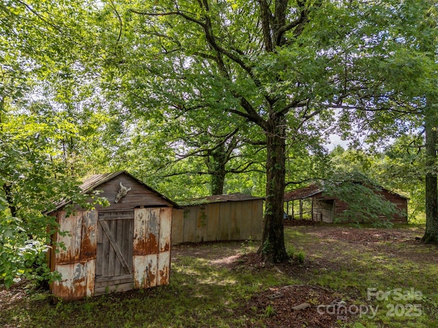 751 Ted Smith Rd, Rutherfordton, NC 28139 - view of yard featuring an outbuilding and a storage shed