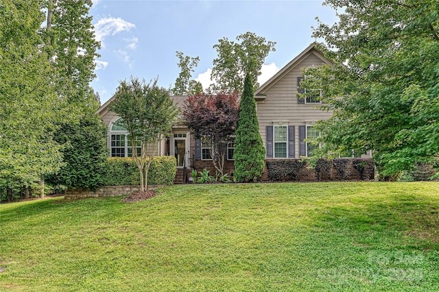 4018 Harmattan Dr, Denver, NC 28037 - obstructed view of property featuring a front lawn and brick siding